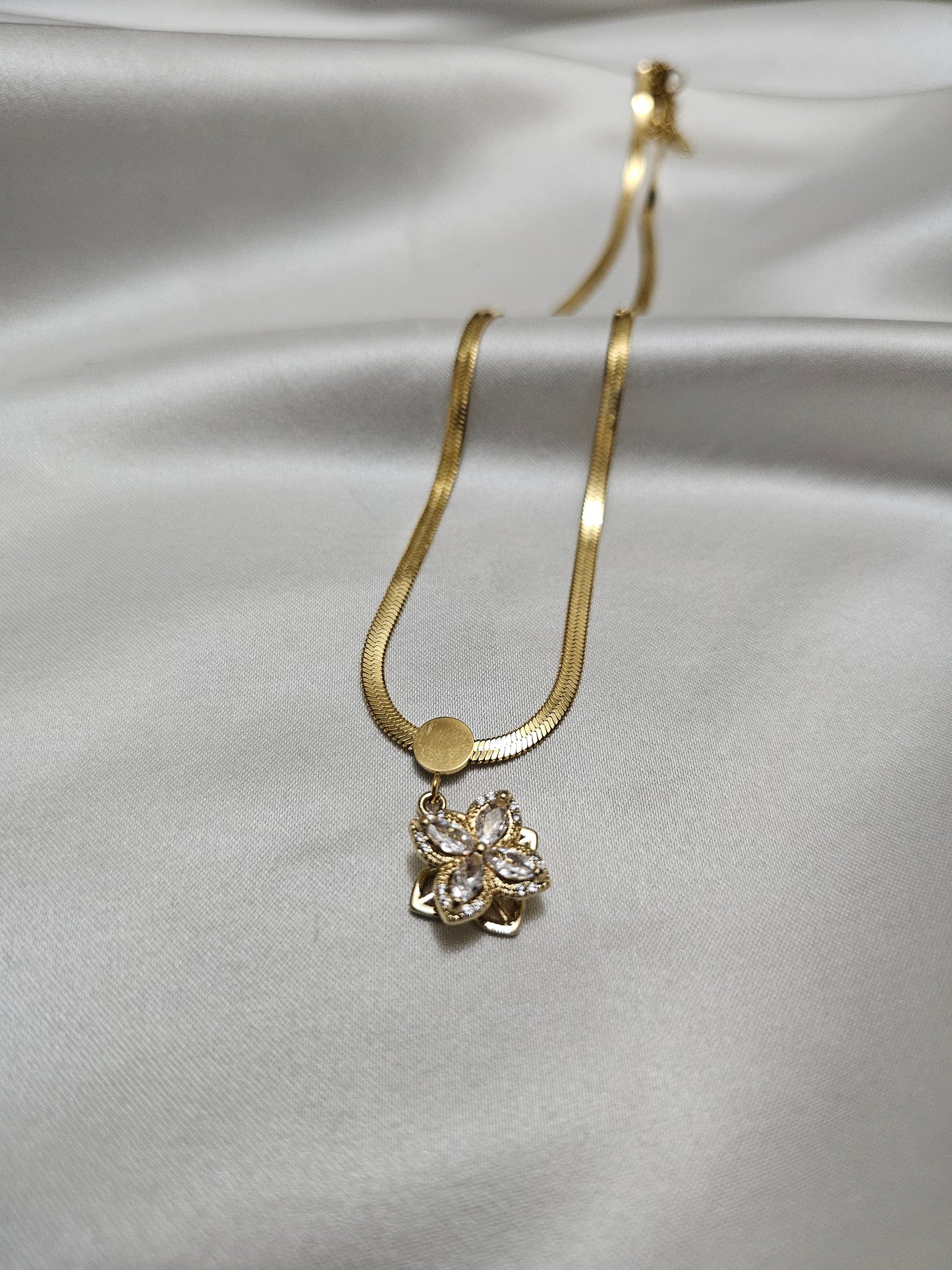 Gold Flower Steel Necklace with Rotating Pendant